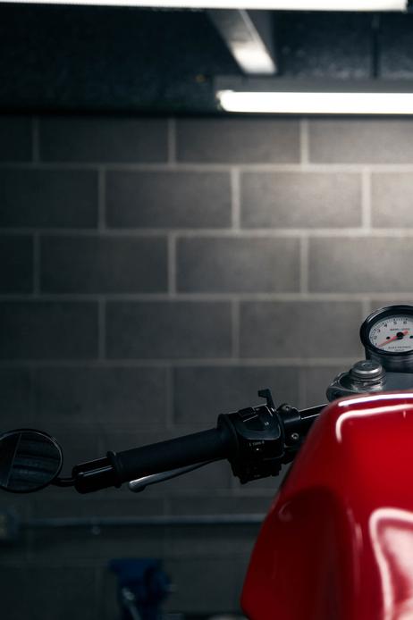 motorcycle in shop night flourescent light