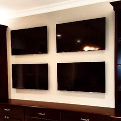 4 TVs Mounted to one wall, TV mounting service in Charlotte NC, Carolina Custom Mounts