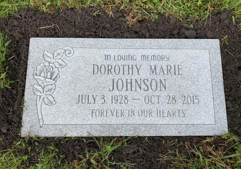 curved rose flat headstone