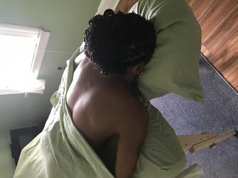 a woman lying on massage bed