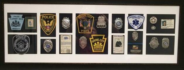 Laird Cole Patch and Badge Display from previous agencies he was associated with.