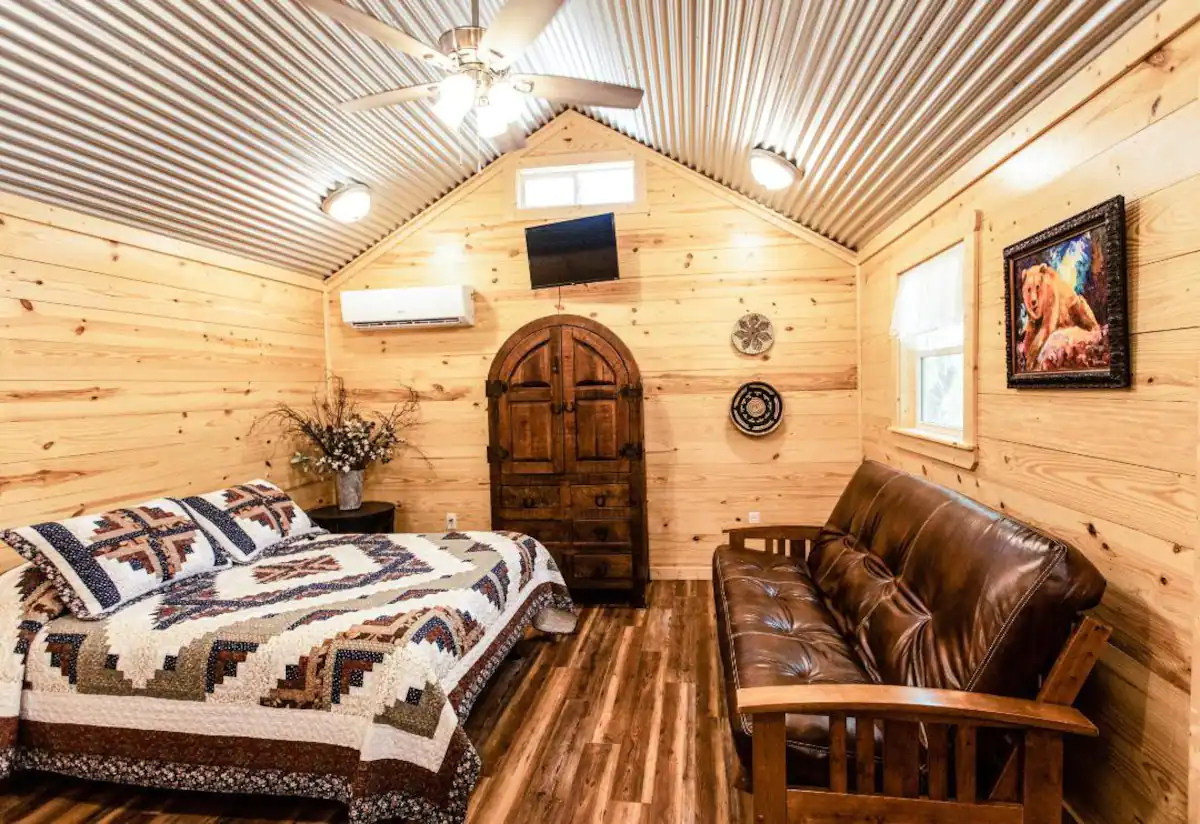 Wolfvalley Buildings LLC in Fort Worth, TX offers a wide range of storage sheds, barns, cabin shells, portable buildings, and tiny homes to suit all your needs. Their shed house interiors are spacious and well-designed, providing the perfect blend of functionality and comfort for a cozy living experience.
