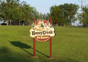 Honey Creek sign at entrance to kennel