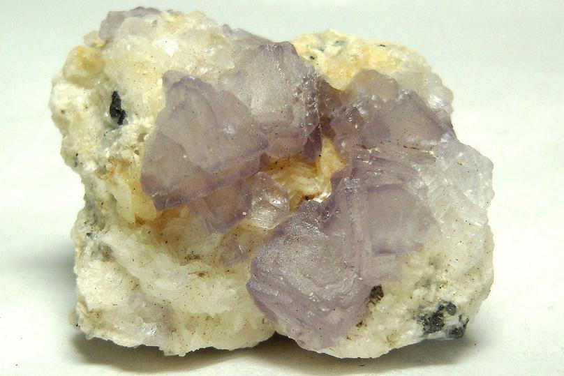 fluorescent FLUORITE on CALCITE with PYRITE, Huanzala Mine, Huallanca District, Bolognesi Province, Ancash Department, Peru