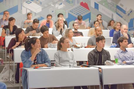 team group meeting indoors classroom style conference room