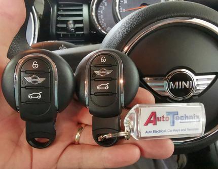 Picture of two Mini FEM 3 button OE remote keys