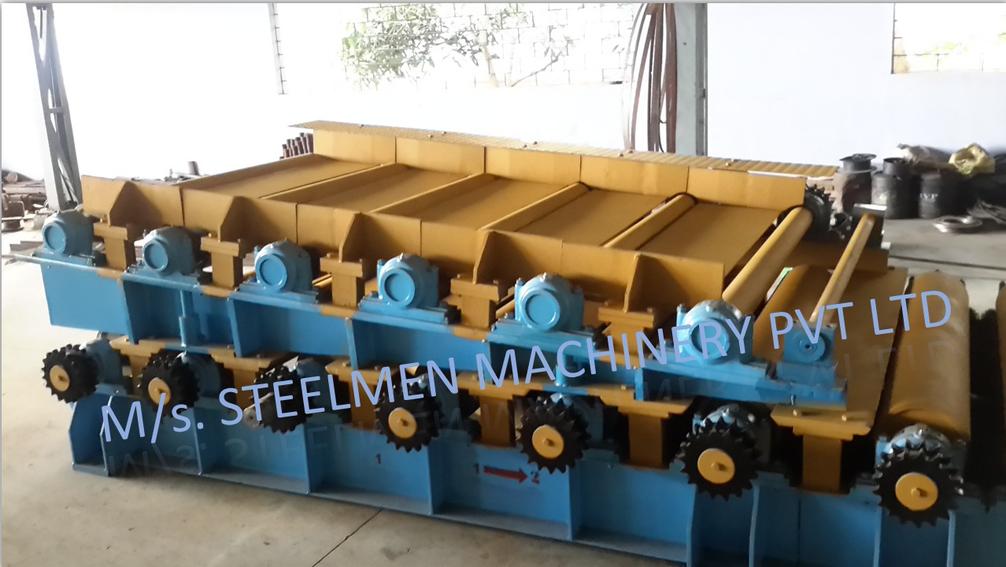 Y-TABLE FOR ROLLING MILLS, OIL LUBRICATION SYSTEM (Capacity - 50 LPM to 300 LPM), AUTOMATIC BUNDLING MACHINE, Hot Billet Shear, Billet Charging Grate, Flywheel, Gear Boxes, Mill Stands, Shearing Machines, Conveyor Rolls, Spindle Carrier, Pinch Rolls, Tilting Tables, Twin Channel, TMT Quenching System, Tail Breaker Pinch Rolls, Oil Lubrication System, Guide Box & Twist Pipes Mechanical Pusher, Mill Accessories, TMT Chain Transfer System, Recuperators, Cooling Tower, gear coupling, universal spindles, steel rolling mill, rolling mill items, steel plant machineries, steel plants, CCM, Continuous casting machine, steel melting, steel makers, leju Thomas, 9310524787, Gear boxes, Pinion stands, Rolling mill Stands on Fiber& bearings, Roller tables, Tilting tables, Y tables, Guide boxes, Chocks, Couplings, Spindles, Rotary shears, Flying shears, Cantilever type pinch Rolls, Tail Breaker pinch Rolls, Quenching Systems (for 8-16 mm, 16-25 mm, & 25-32 mm), Twin channel, Hot Rolling Mills, Shears, Automatic Cooling Bed, Quenching Boxes, Twin Channel Machine, Mill Stands, Cold Rolling Mills, Gear Couplings, Industrial Gear Box, Punching Cropping Machine, Hot Saw, Transmission Tower Machinery, Chain Transfer Systems, Product Design Development, Hot Rolling Mills Bar Rolling Mill Hot Rolling Mill Equipment Slit Rolling Mill Shears Flying Shear Crank Shear Continuous Rotating Shear Disc & Drum Shear Automatic Cooling Bed Quenching Boxes TMT Quenching Boxes Twin Channel Machine Industrial Gear Box Helical Gear Box Rolling Mill Gear Boxes Mill Stands Rolling Mill Stands TMT Mill Stands Housingless Mill Stands Cold Rolling Mills Gear Couplings Gear Jobwork Punching Cropping Machine Hot Saw Traveling type Hot Saw Fixed type Hot Saw Transmission Tower Machinery Chain Transfer Systems Product Design Development, Turnkey Solutions For Hot Rolling Mills Coilers Mill stands Shears & hot saws Twin channel Cooling beds Gear boxes & pinion stands TMT Equipment, Rolling Mill Machines Blade Grinding Machine Hot Saw Machines Straightening Machine Hydraulic Pusher, Hydraulic Cylinders, Ejectors, Hot Rolling Mill Flywheels Gear Boxes Mill Stands Gear Couplings Material Handling Equipment TMT Equipment Cooling Bed Shearing Machines Straightening Machines Spare Parts Of Rolling Mills Other Allied Equipments Bending & Time Machine Workshop Machinery, ♦ Bar Mills ♦ Structural Steel Mill Wire Rod Mill with Bar in Coil Line Rolling Mill for High-Grade Steels Section Mill High Speed Laying Head with Gear Box Crank Lever Shears Crank Shears Housingless Stands Double Crank Shears Rake Type Cooling Conventional Mill Stands Gear Boxes Rod mill block Varioblock Flying Shear • Tail Braking Pinch Roll • Cold Shear, Starting Stock Billets 160 x 160 x 12,000 mm 130 x 130 x 12,000 mm Furnace Group Charging grate, Hot charging, Elevator, Induction online heater Finished product Rebar 8 three-strand slit TMT Rebar 10 two-strand slit TMT Rebar 12-40 mm TMT Flats, angles and channels are possible too Sub-bundles 100-400 kg Master bundles 1 MT-3 MT Furnace Capacity 80 MT/h Main train Single-strand H/V arrangement, two strands are H/V type Roughing train : 4 off Model 600, 2 off Model 440, Free outlet after stand # 2 Intermediate train : 4 off Model 440, 4 off Model 340 Finishing train : 6 x Model 340 Associated shears Loopers : 8 off vertical, 6 off Single strand, 2 off multi strand Capacity 400,000 MT/y Cooling bed group Water quenching line, Thermex Cooling bed shear Cooling bed 66 x 10 m Finished speed 16 m/s (20 m/s) Material grades Carbon steels, Alloyed Structural Steel grades Continuous finishing shop Stationary cold shear 3,000 kN Counting system Small bundle forming 4 off Tying machine Various associated equipment, e.g. stoppers, chain transfers, roller tables, Starting stock Blooms 180 x 180 x 8,000 - 12,000 mm 300 x 300 x 8,000 - 12,000 mm Finished product Rebars 28 - 40 mm Rounds 30 - 100 mm dia. Hexagons 50 - 80 mm Flats 8 x 30 - 60 x 150 H-Beams 100 - 180 mm I-Beams 100 - 200 mm T-sections 75 - 140 mm Channels 100 - 200 mm Angles 80 x 80 x - 200 x 200 mm U-type sections for mine timbering 18U, 25U,29U Bundle/stack length 6 - 24 m Bundle/stack weight 2 - 5 t Furnace capacity 116/143 t/h Annual capacity 700,000 t/y Finishing speeds 6 m/s Material grades Carbon steels, Alloyed structural steel,Antifriction bearing steel Furnace group: Elevator (for hot charging), charging grate,weighscale, descaler, insulated holding tunnel Mill train: Single strand Roughing train 4 x Model 670, 1 x Model 760(V-H-HV-H) Intermediate train: 2 x Model 760, 4 x Model 670(H-H-H-UR-UR-HV) Finishing train: 5 x Model 670 (UR-HV-UR-HV-FUR) Associated shears Loopers: 4 x vertical Cooling bed group: Water cooling line, pinch roll unit Cooling bed shear Cooling bed 84 x 19 m Short-bar collecting device Continuous finishing shop In-line straightening machine (10 rollers) Hot saws: 1 x stationary, 1 x movable Abrasive cutting machines: 1 x fixed, 1 x movable Piling and stacking facilities (magnet-type) Tying machines: 2 x stationary, 2 x movable Various associated equipment, e.g. stoppers, chain transfers, roller tables. upto 150 x 150 x 12,000 mm Finished product: Wire rod 5.5 - 16 mm Rebars Nos. 3, 4 and 5 (as per ASTM) Coils 16 - 42 mm dia. Furnace capacity: 70 t/h Annual capacity: 300,000 t/y Finishing speeds: Wire rod line - 100 (120) m/s Bar in coil line - 13.5 m/s Material grades: Cold-heading steels Reinforcing steels Steels with a carbon content from low to medium Piano-wire PC-wire Free-cutting steel Water cooling line, pinch roll units, bar reels (2x), coil transfer,chain conveyor with retarded and accelerated cooling facilities, transfer unit to Power & Free coil handling system, Starting stock Billets 50 x 100 x 10,000 mm 125 x 125 x 11,400 mm Finished product Rod 5.5 - 13.5 mm dia. Bars 11 - 57 mm dia. Flads 22 - 120 mm, 5 - 12 mm thick Bundle/stack length 3 - 8.5 m Bundle/stack weight 0.5 - 3 (5) t Furnace capacity up to 60 t/h Material grades High-grade structural steels 34 Cr 4, 60 SiMn7, 42 CrMo4 Antifriction bearing steels 100 Cr 6, 100 Cr 2, 100 CrMo 7 3 Material grades Tool steels X 210 Cr 12, X 38 CrMoV 5 1, 55 CrNiMoVS 4 2 4 Acid-resistant and heat-resistant steels X 5 CrNiMo 18 11, X 2 CrNiMo 19 13,X 20 CrNiSi 25 4 High-speed steels X 79 Wco 18 5, X 82 W Mo 6 5 5 Special alloys X 55 CrMnNiN 20 8,X 45 CrSi 9 3 X 3 CrNiMoNbN 23 17 The complete range of steel grades includes approx. 300 different grades Furnace group: Charging grate, cross transfers, weighscale, descaler (2x), heatholding tunnel Mill train: Single strand, H/V - arrangement Roughing train: PSW and 6 x Model 440 Intermediate train: 4 x Model 440, 2 x Model 340 Finishing train: 4 x Model 340 Kocks-block 8-stand wire rod block for high grade steels 3 x 215/ 5 x 170 Associated shears Loopers: 7 x vertical, 1 x horizontal Cooling bed group: Water cooling line, pinch roll unit Cooling bed shear Cooling bed 57 x 5 m Continuous finishing shop: Abrasive cutting machine Piling and stacking facilities (non-magnet type) Tying machines: 1 x fi xed, 1 x movable various associated equipment, e.g. stoppers, chain transfers, roller tables etc. Rod finishing equipment: Water cooling and equalizing sections, pinch roll unit,laying head Ring conveyor for retarded and accelerated cooling reforming tub Pallet-type coil handling system, compacting & tying units,weighscale, unloading station Reel plant Water cooling and equalizing sections, Pinch roll units, Bar reels: 2 x, Transfer equipment to pallet-type coil handling system, Omsairam Steel & Alloys Pvt. Ltd., Bhagyalaxml Rolling Mills Pvt. Ltd., Kalika Re-rollers Pvt. Ltd., Parvati Alloys (P) Ltd., MITC Rolling Mills (P) Ltd., Maharashtra Steel Rolling & Engg Co. Chimanlal Vijay Kumar Steels Pvt. Ltd, Bhagwati Ferro Metals (P) Ltd, Balbir Rolling Mills Ltd. Quartz Metals Inds., Metro Alloys Ltd., Pushpak Steel Inds. Pvt Ltd., T. k. Ispat Pvt Ltd., Allied Ferromelt Pvt Ltd., Bhagwati Steel Cast Ltd., R. L. Steels Ltd., Guardian Steels Pvt. Ltd., Shri Karvir Nivasini Mahalakshmi Ispat Pvt. Ltd., Khatu Shyamji Steel Rolling Mills Pvt. Ltd., Kunal Ispat & Alloy Inds. Pvt Ltd. Sun Metallics & Alloys Pvt. Ltd, Hans Ispat Ltd. Shri Khatu Shyam Industries, Rajuri Steel Pvt. Ltd, Shree Om Steel Rolling, Air Carrying Corpn (I) Ltd., titan Alloys Ltd. Sunflag Iron & Steel Co. Ltd., Sharda Ispat Ltd., Fortune Metaliks Ltd., Sharda Shree Ispat Ltd., R. K. Structures Pvt. Ltd., Sanvijay Industries Pvt. Ltd., Shivali Udyog (I) Ltd., S.D. Bansal Iron & Steel Pvt. Ltd., Inertia Iron & Steel Inds. Pvt. Ltd., Nalwa Steel & Power Ltd., Shilpa Re-rollers Ltd., Sri Jai Balaj Steel Rolling Mills Ltd., Petropol India Ltd. Galwalia Ispat Udyog Pvt. Ltd. Crest Steel & Power Pvt. Ltd. Himalayan Rolling Steel Industries Pvt. Ltd., Shree Balaji Pigments Pvt. Ltd., Upper India Steel Mfg. & Engg. Co. Ltd., Capital Ispat Ltd., Barnala Steels Inds. Ltd., Shri S.S. Shyam Steels Pvt. Ltd. Fortune Metals Ltd. Rathi Udyog Ltd., M/s. Gallantt Ispat Lyd., Gemini Merchandise Pvt. Ltd., Jagdamba Rolling Mills, Shree Krishna Steel Rolling (Jaipur) Ltd. Modi Steels, Usha Martin Inds. Prince TMT Steels Pvt. Ltd., Dindigul Iron & Steel Co (P) Ltd. ARS Metals Ltd. V.V. Iron & Steel Company Pvt Ltd. Jairaj Ispat Ltd., Pioneer Torsteel Mills (P) Ltd., Devshree Ispat Pvt. Ltd., Vaibhav Merchantile Ltd., Maa Mahamaya Inds. Pvt. Ltd., Chitrakoot Metal Ltd. P. R. Rolling Mills Pvt. Ltd. Shree Aravindh Steels Ltd. Shyam Steel Industries Ltd. Shri Ramrupai Balaji Steels Ltd. Adhunik Ispat Pvt. Ltd. Durgapur Steels Ltd. B. M. A. Stainless Ltd. Zion Steel Ltd. Shree Metaliks Ltd. Usha Martin Ltd. Shyam Sel Ltd. Maithan Steel & Power Ltd.