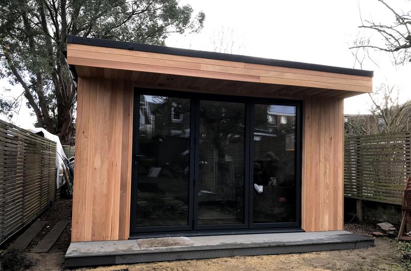 Large modern garden room with pool table and bar