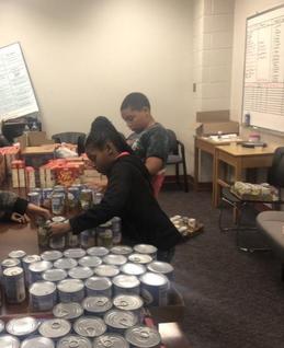 2018 Lit to Learn packing turkey items for HTBA's Turkey Drive