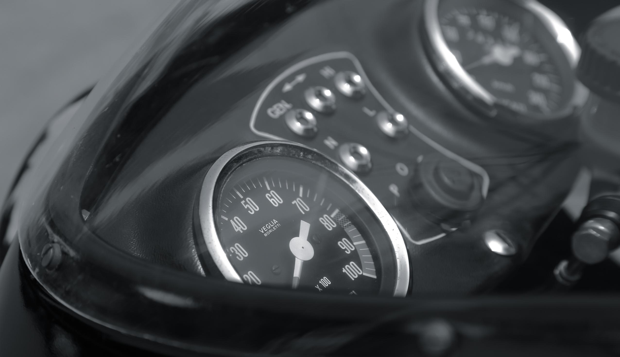 vintage motorcycle group ride BMW and ducati through the curve fast