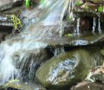 A serene waterfall cascading down rocks