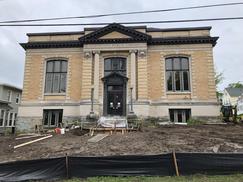 Front shot of building with cleared out dirt lawn