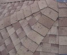 Golf Ball Sized Hail Damage To A Laminate Shingle