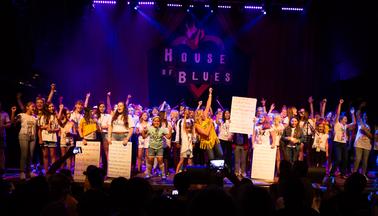 Fifty girls on stage at the House of Blues singing