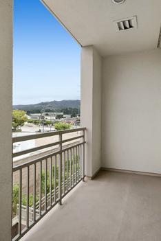 Balcony with view of hills