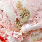 Cheesecake ice cream swirled with a strawberry ripple and loads of gooey cheesecake pieces.