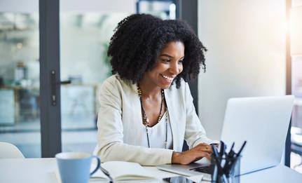 Woman typing on a laptop