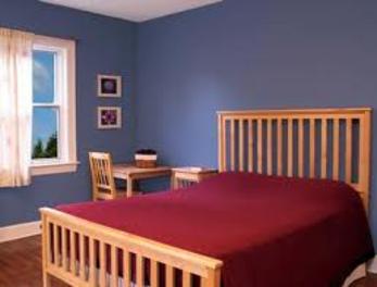 Painted bedroom with blue walls.