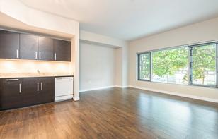 Main room with kitchen, living area and large window