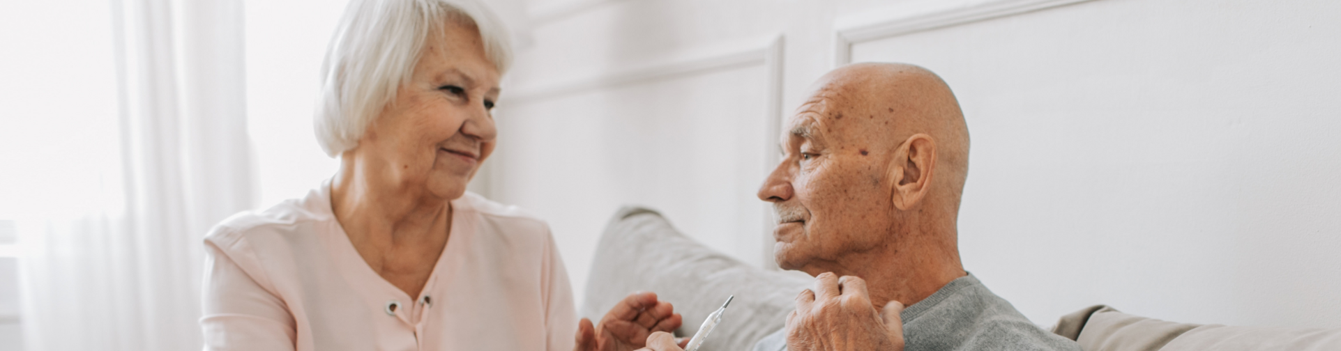 Family member speaking to elderly senior family member about assisted living