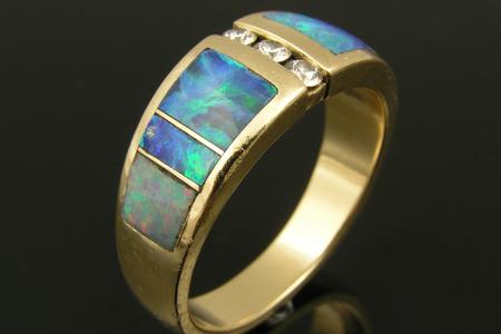 Opal inlay ring with damaged opal and non-matching end opal.