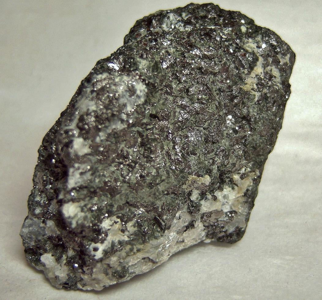 Graphite, fluorescent Meionite Scapolite, green pyroxene - Lead Hill Mines (Chilson Hill mine), Ticonderoga, Ticonderoga Township, Essex County, New York, USA