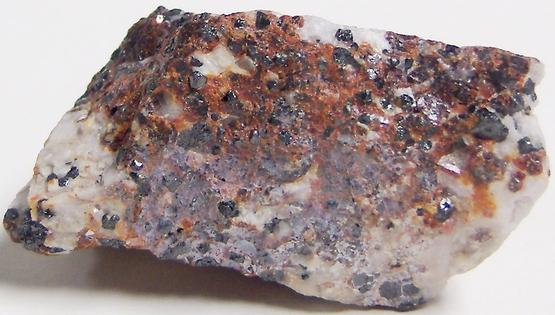 Black Franklinite, red Zincite, white Hydrozincite, green fluorescent Willemite, white Calcite - Sterling Mine, Sterling Hill, Ogdensburg, Franklin Mining District, Sussex County, New Jersey, USA