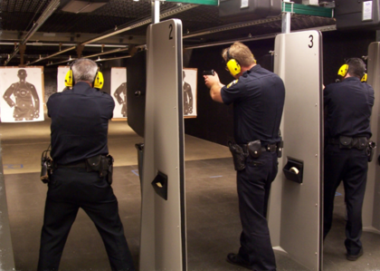 Several police officers shooting on an indoor range
