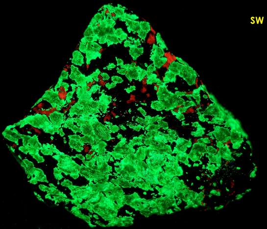 FRANKLINITE, fluorescing WILLEMITE, CALCITE - Sterling Mine, Sterling Hill, Ogdensburg, Franklin Mining District, Sussex County, New Jersey, USA - Franklinite type locality