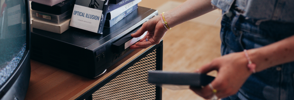 Technician carefully digitizing VHS tape to USB with professional equipment, preserving family memories in Dartmouth MA