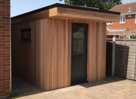 Modern cedar clad garden office with side window in Wickford, Essex built by Robertson Garden Rooms