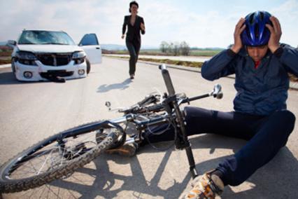 Injured bicyclist on the ground