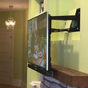Down and Out fireplace TV mount, easily pulls down over fireplace mantle to a more comfortable viewing height, Charlotte NC 4k ultra hd tv over fireplace mounting service