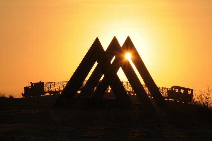 Sunrise at Sculpture in the Parklands with SkyTrain and 60 Degrees sculptures