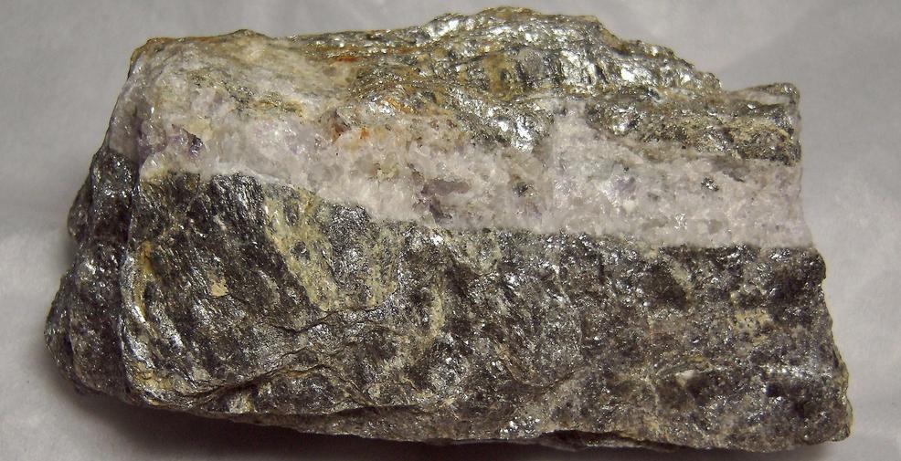 fluorescing FLUORITE, CALCITE, PYRITE with MUSCOVITE - Thomaston Dam railroad cut, Thomaston, Litchfield County, Connecticut, USA