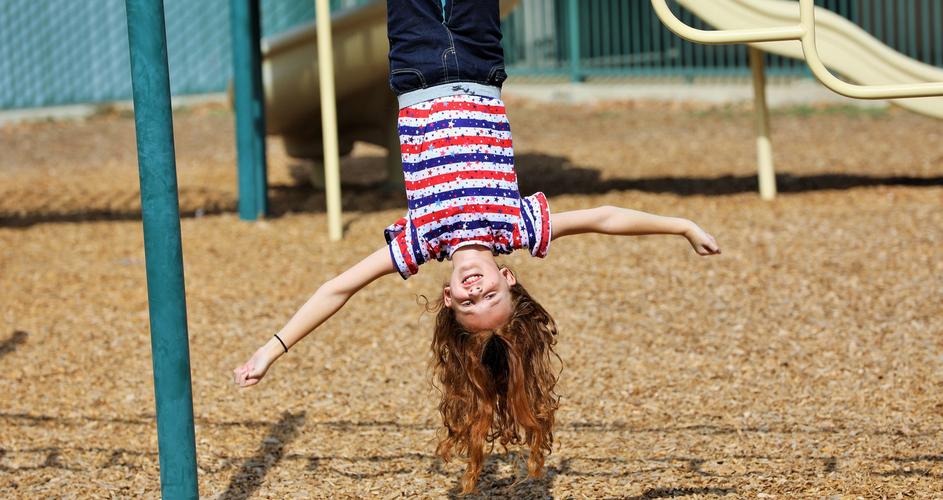 Girl on playset at private Catholic school in Hanford