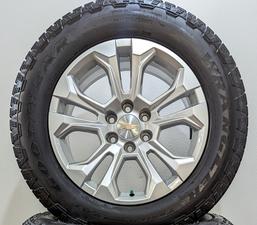 New Chevy LTZ silver split spoke wheels with Goodyear Trailrunner AT tires.