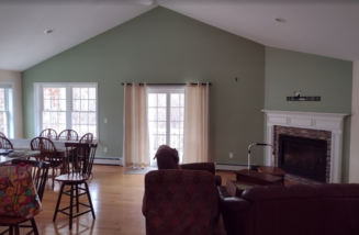 Living room walls painted with "sherwood green".