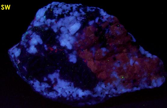fluorescent SCAPOLITE, CORUNDUM SAPPHIRE, PLAGIOCLASE ALBITE ANORTHITE, BIOTITE -York River area, Dungannon Township, Hastings County, Ontario, Canada