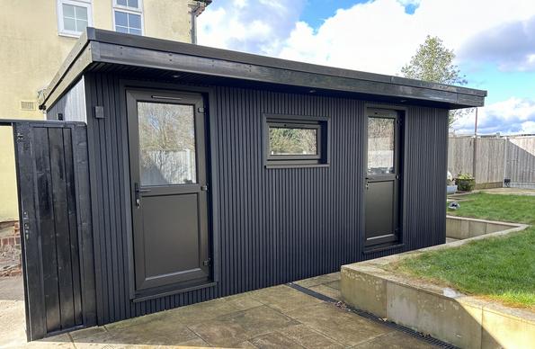 Large modern garden room with pool table and bar