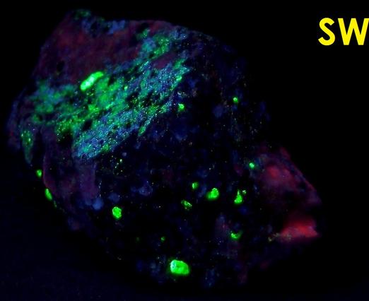 Black Franklinite, red Zincite, white Hydrozincite, green fluorescent Willemite, white Calcite - Sterling Mine, Sterling Hill, Ogdensburg, Franklin Mining District, Sussex County, New Jersey, USA