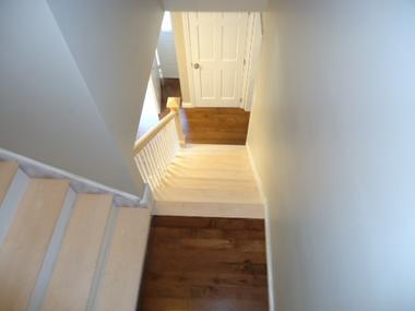 staircase before staining and painting in Mansfield.