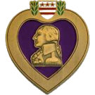 The Purple Heart City emblem, with a purple heart and a gold profiled view of George Washington inside it.