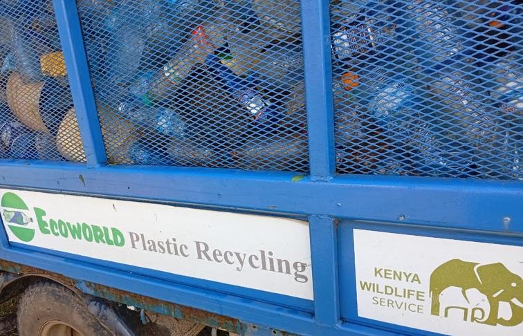 Garbage collection truck with collected plastics to be recycled