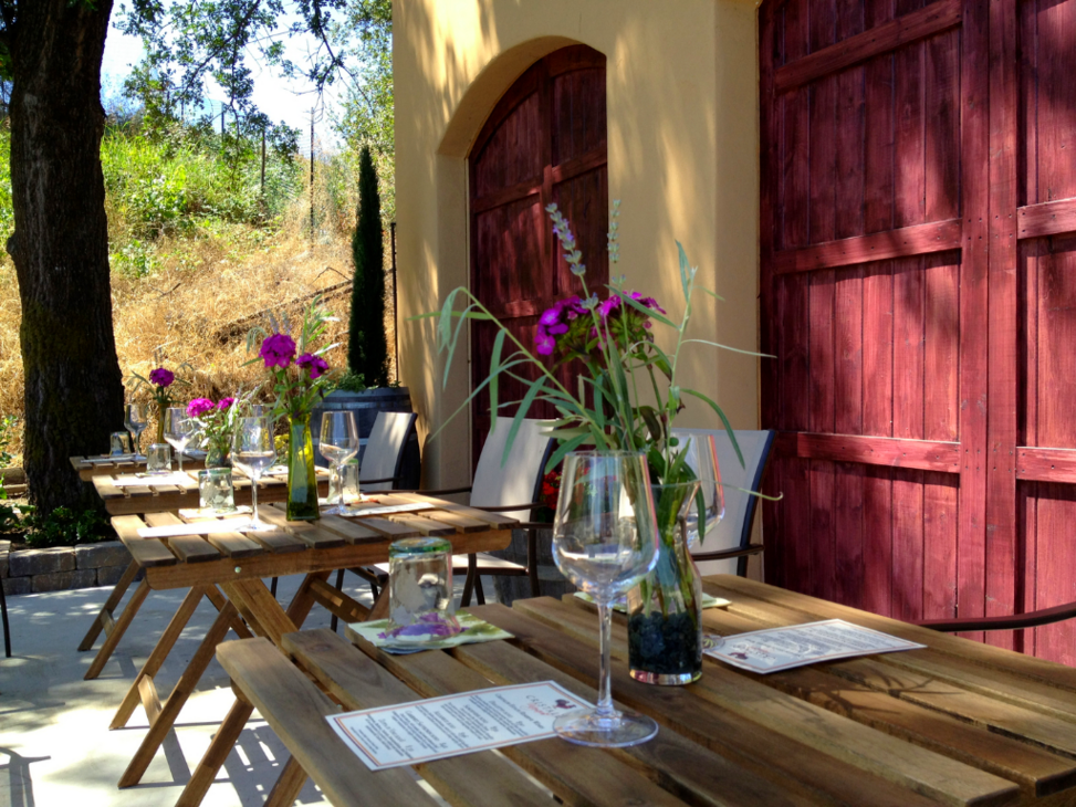 Tables set for wine tasting in front of the winery