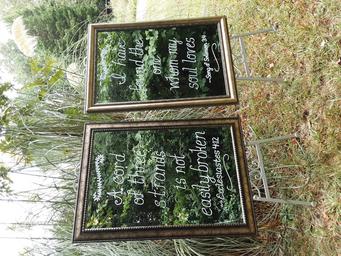 Two similar mirrors with handlettering with easels.