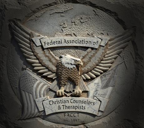 A stone engraving of the FACT emblem featuring an American Bald Eagle holding an American Flag and a Christian Flag with a banner at the top stating Federal Association of and a banner at the bottom stating Christian Counselors & Therapists. Under the bottom banner is FACCT 1993.