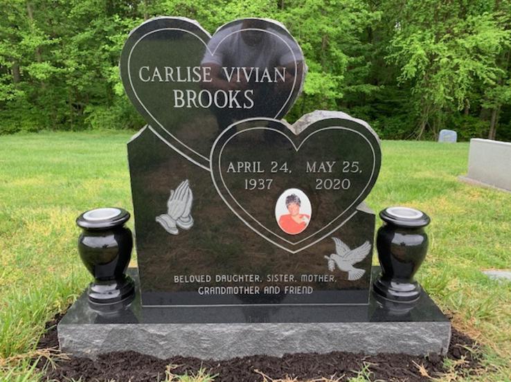 stacked hearts headstone with flower vases
