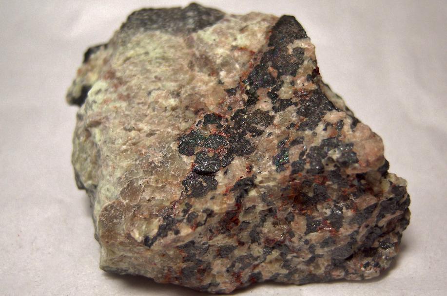 SW LW fluorescent Willemite, red Zincite, black Franklinite - Franklin Mine, Franklin, Franklin Mining District, Sussex County, New Jersey, USA - type locality
