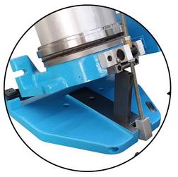 A close-up shot of a rotary grinding table with sine plate for angled rotary grinding